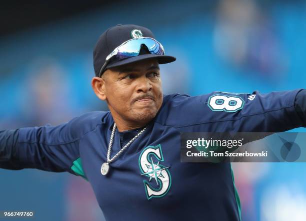 Batting practice pitcher Nasusel Cabrera of the Seattle Mariners pitches during batting practice before the start of MLB game action against the...