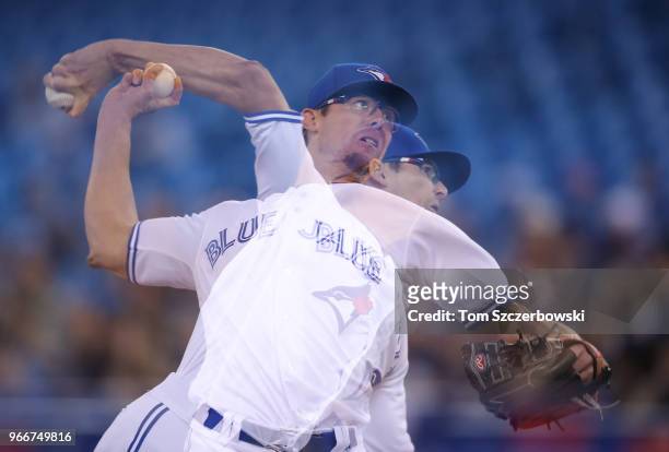 Tyler Clippard of the Toronto Blue Jays delivers a pitch in the ninth inning during MLB game action against the Seattle Mariners at Rogers Centre on...