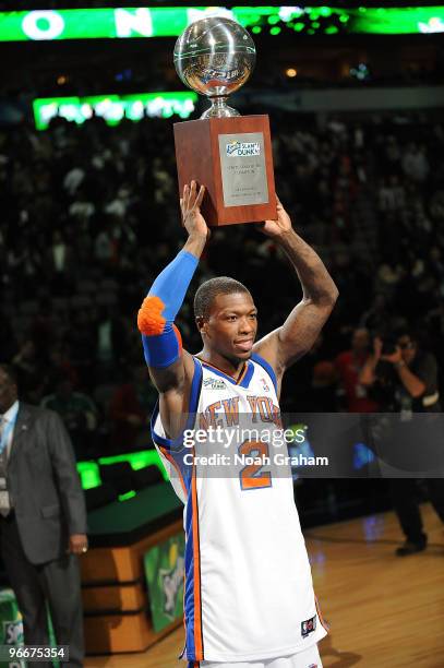 Nate Robinson of the New York Knicks poses with his trophy after winning the Sprite Slam Dunk contest as part of All Star Saturday Night during 2010...