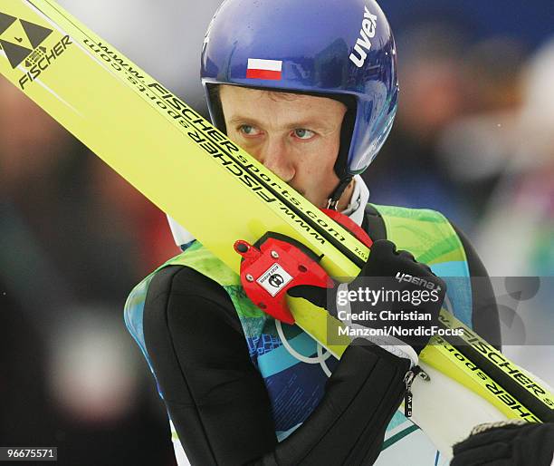 Adam Malysz of Poland celebrates after after taking second place in the Ski Jumping Normal Hill Individual event on day 2 of the Olympic Winter Games...