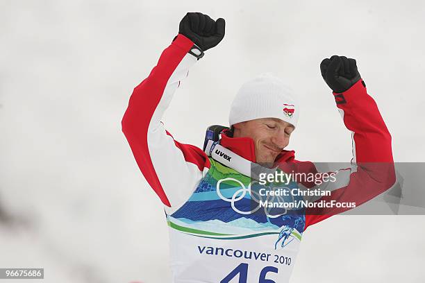 Adam Malysz of Poland celebrates after after taking second place in the Ski Jumping Normal Hill Individual event on day 2 of the Olympic Winter Games...