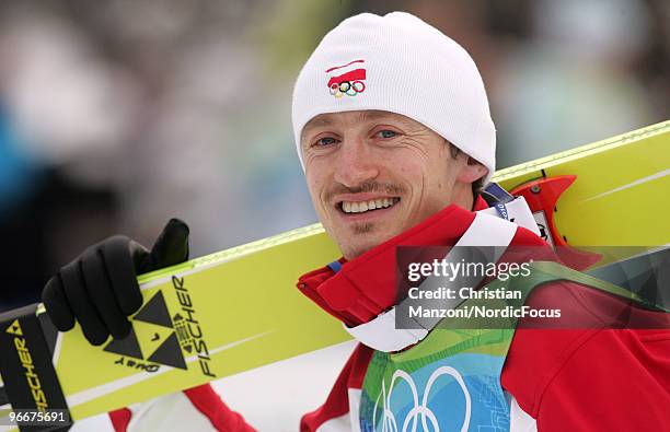 Adam Malysz of Poland celebrates after after taking second place in the Ski Jumping Normal Hill Individual event on day 2 of the Olympic Winter Games...