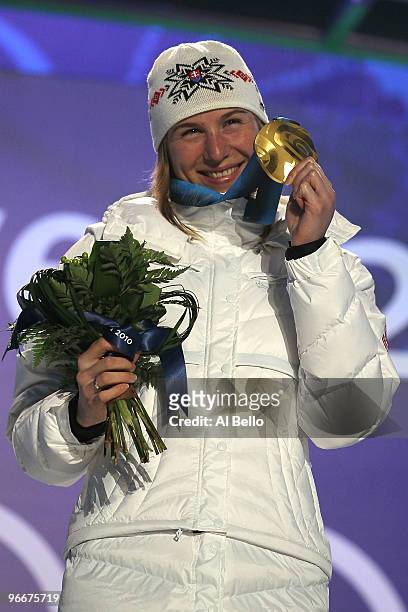 Anastazia Kuzmina of Slovakia celebrates with the gold medal during the Medal Ceremony for the Women's Biathlon 7.5 km Sprint on day 2 of the...
