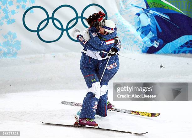 Shannon Bahrke of United States hugs Hannah Kearney of United States who fell during the women's freestyle skiing moguls final on day 2 of the...