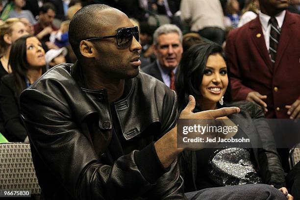 Kobe Bryant of the Los Angeles Lakers smiles with his wife Vanessa Lynne during the Taco Bell Skills Challenge on All-Star Saturday Night, part of...