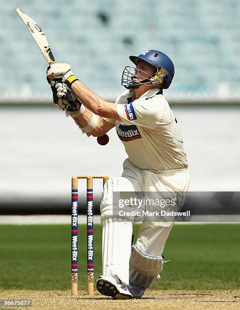 Chris Rogers of the Bushrangers is struck on the elbow during day three of the Sheffield Shield match between the Victorian Bushrangers and the...