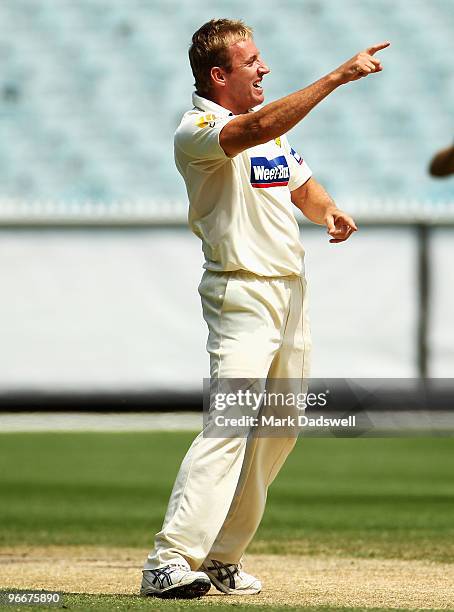 Damien Wright of the Bushrangers celebrates trapping Phil Jaques of the Blues for lbw during day three of the Sheffield Shield match between the...