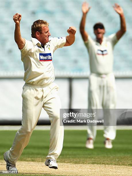 Damien Wright of the Bushrangers celebrates trapping Phil Jaques of the Blues for lbw during day three of the Sheffield Shield match between the...