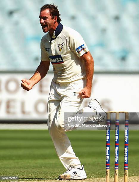 John Hastings of the Bushrangers celebrates the wicket of Simon Katich of the Blues caught by Damien Wright in the gully during day three of the...