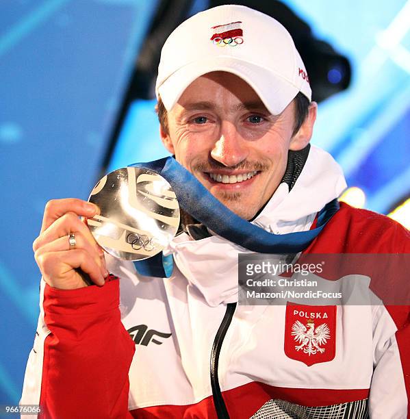 Adam Malysz of Poland displays his silver medal during the medal ceremony for the Ski Jumping Normal Hill Individual event on day 2 of the Olympic...