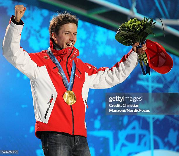 Swiss Simon Ammann celebrates on the podium during the medal ceremony for the Ski Jumping Normal Hill Individual event on day 2 of the Olympic Winter...