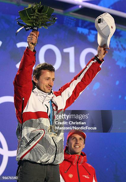 Adam Malysz of Poland celebrates his silver medal during the medal ceremony for the Ski Jumping Normal Hill Individual event on day 2 of the Olympic...