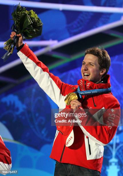 Simon Ammann of Switzerland celebrates with his gold medal during the Medal Ceremony for the Ski Jumping Normal Hill Individual on day 2 of the...