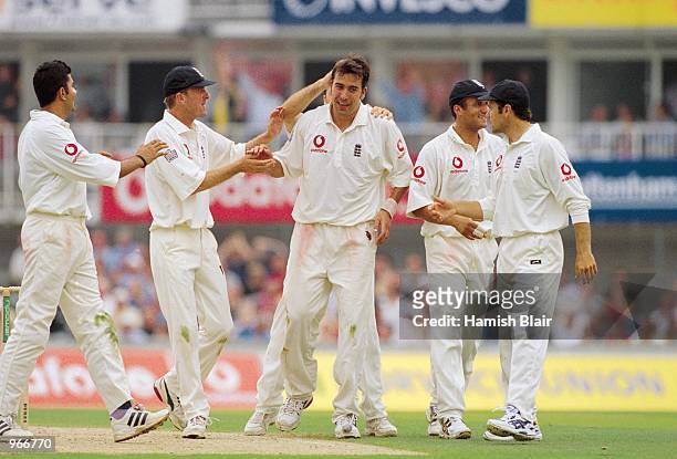 James Ormond is congratulated by his England teamates during the Fifth Ashes Test match against Australia played at The Oval in London. Australia won...