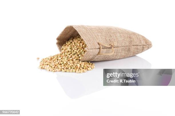 organic bio buckwheat raw in a hessian sack on white - buckwheat isolated stock pictures, royalty-free photos & images