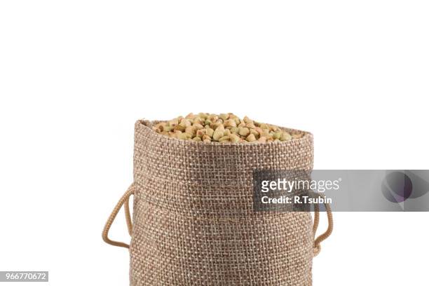 organic bio buckwheat raw in a hessian sack on white - buckwheat isolated stock pictures, royalty-free photos & images