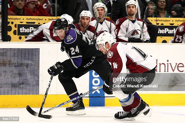 Alexander Frolov of the Los Angeles Kings skates against John-Michael Liles of the Colorado Avalanche during their game on February 13, 2010 at...