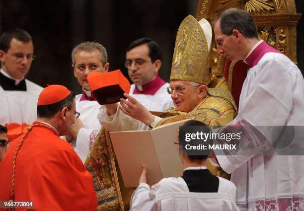 New cardinal Angelo Amato receives the biretta cap from Pope Benedict XVI. Pope Benedict XVI installed 24 new cardinals during a consistory ceremony...