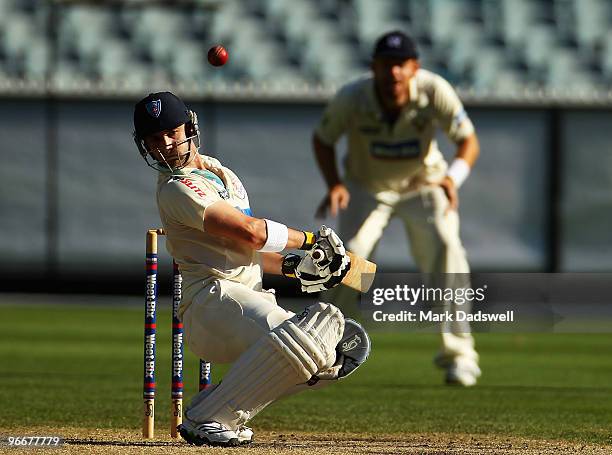 Phillip Hughes of the Blues ducks under a bouncer during day three of the Sheffield Shield match between the Victorian Bushrangers and the Queensland...