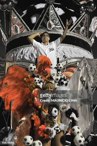 Brazilian soccer striker Ronaldo of the Corinthians football club parades atop of a float of the Gavioes da Fiel samba school at the Sambadrome, as...