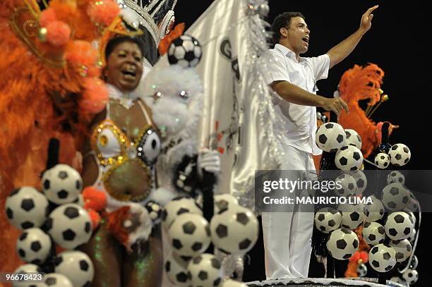 Brazilian soccer striker Ronaldo of the Corinthians football club parades atop of a float of the Gavioes da Fiel samba school at the Sambadrome, as...