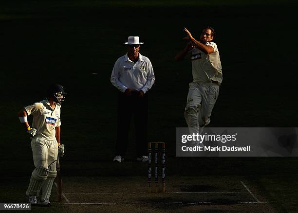 John Hastings of the Bushrangers bowls during day three of the Sheffield Shield match between the Victorian Bushrangers and the Queensland Bulls at...