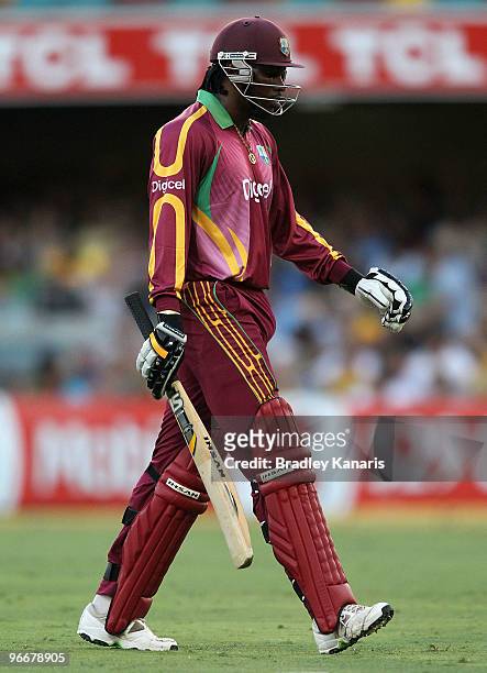 Chris Gayle of the West Indies walks from the field after he is dismissed off the bowling of Doug Bollinger of Australia during the Fourth One Day...