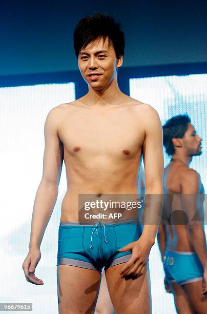 Xiadai Muyi of China walks on stage during the final of the Worldwide Mr. Gay contest in Oslo, late on Februaray 13, 2010. The Worldwide Mr. Gay...