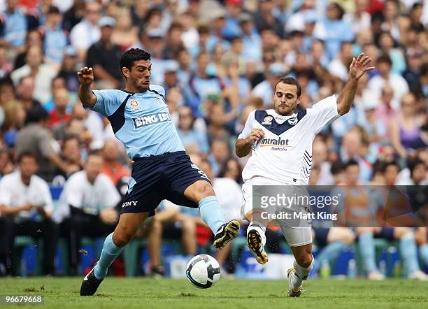 John Aloisi of Sydney and Tom Pondeljak of the Victory compete for the ball during the round 27 A-League match between Sydney FC and the Melbourne...