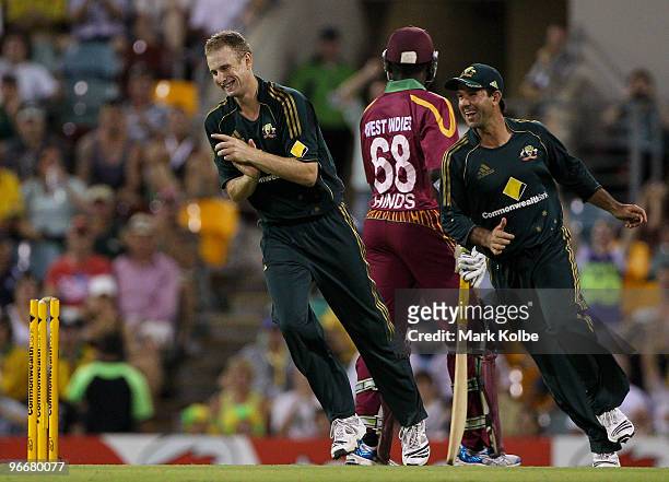Adam Voges and Ricky Ponting of Australia celebrate the run-out of Wavell Hinds of the West Indies during the Fourth One Day International match...