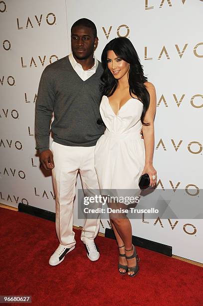 Reggie Bush and Kim Kardashian arrives at Lavo on February 13, 2010 in Las Vegas, Nevada.