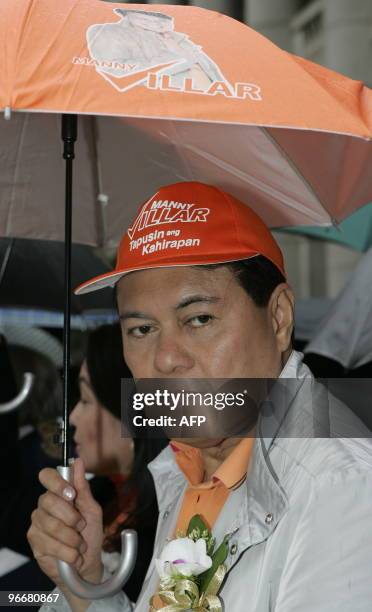 Leading Philippine presidential candidate Manuel Villar attends an El Shaddhai Chinese New Year celebration outside the Legislative Council building...