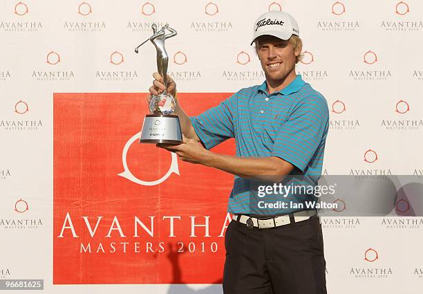 Andrew Dodt of Australia celebrates with the trophy after winning Final Round of the Avantha Masters held at The DLF Golf and Country Club on...