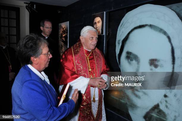 Pope Benedict XVI visits the Cachot, a one-room home where Bernadette Soubirous lived with her empoverished family, in Lourdes. Pope Benedict XVI...