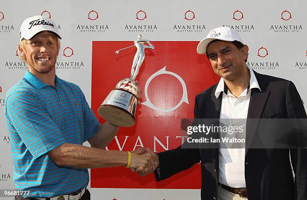 Andrew Dodt of Australia celebrates with the trophy after winning Final Round of the Avantha Masters held at The DLF Golf and Country Club on...