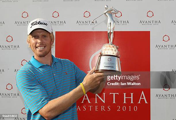 Andrew Dodt of Australia celebrates with the trophy after winning Final Round of the Avantha Masters held at The DLF Golf and Country Club on...