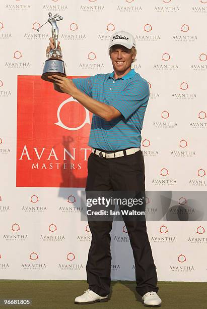 Andrew Dodt of Australia celebrates with the trophy after winning Final Round of the Avantha Masters held at The DLF Golf and Country Club on...