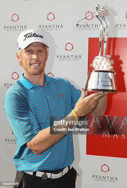 Andrew Dodt of Australia celebrates with the trophy after winning Final Round of the Avantha Masters held at The DLF Golf and Country Club on...