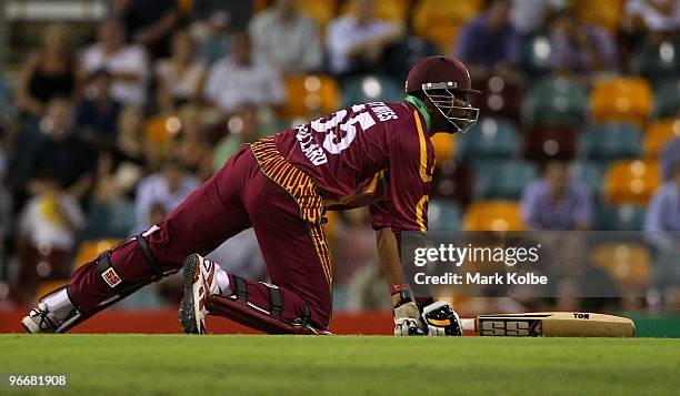 Kieron Pollard of the West Indies loses his footing during the Fourth One Day International match between Australia and the West Indies at The Gabba...