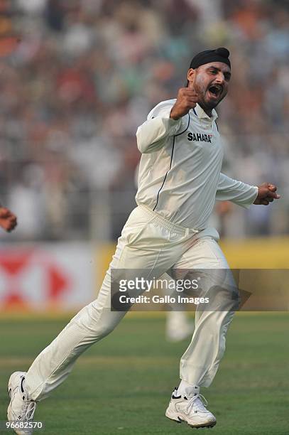 Harbhajan Singh of India celebrates his 350th Test wicket during day one of the Second Test match between India and South Africa at Eden Gardens on...