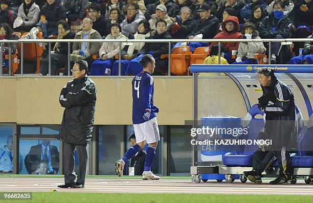 Japan's defender Marcus Tulio Tanaka leaves the field after his red card during their match of the East Asian football championship against South...