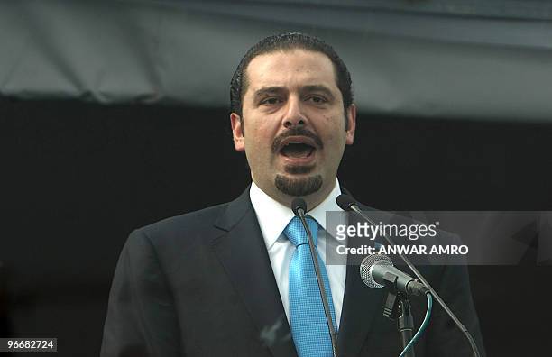 Lebanese Prime Minister Saad Hariri delivers a speech behind bullet-proof glass during a rally marking the fifth anniversary of the assassination of...