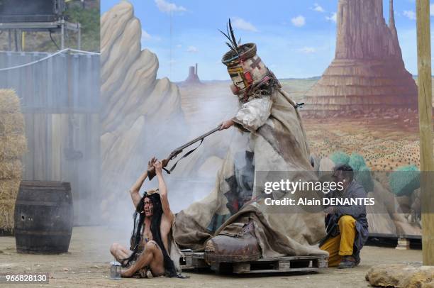 The famous French street theater Royal De Luxe company presents its new show, a western called "Rue de la Chute" in the castle yard, on June 15, 2012...