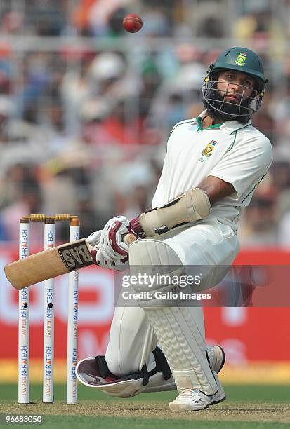 Hashim Amla of South Africa evades a bouncer during day one of the Second Test match between India and South Africa at Eden Gardens on February 14,...