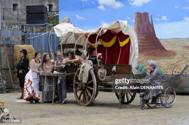 The famous French street theater Royal De Luxe company presents its new show, a western called "Rue de la Chute" in the castle yard, on June 15, 2012...
