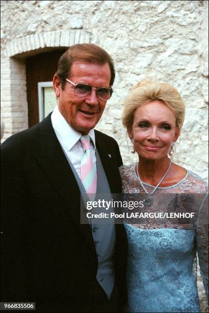 Roger Moore and wife.