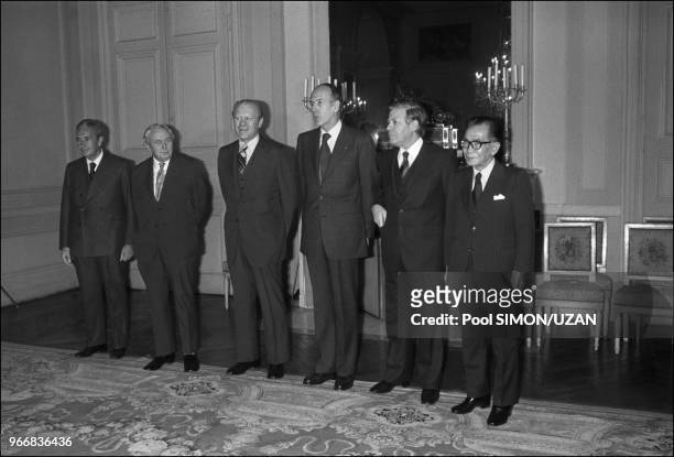 Aldo Moro , Harold Wilson , Gerald Ford , Valery Giscard d'Estaing , Helmut Schmidt and Takeo Miki .