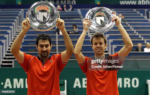 Nenad Zimonjic of Serbia and Daniel Nestor of Canada celebrate with the trophies after defeating Simon Aspelin of Sweden and Paul Hanley of Australia...