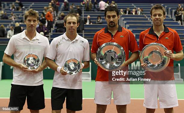 Nenad Zimonjic of Serbia and Daniel Nestor of Canada celebrate with the trophies after defeating Simon Aspelin of Sweden and Paul Hanley of Australia...