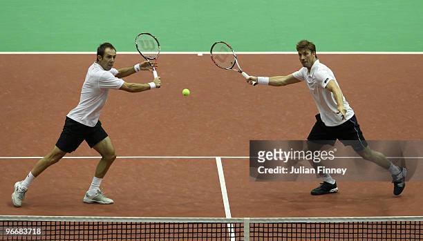 Simon Aspelin of Sweden and Paul Hanley of Australia in action against Nenad Zimonjic of Serbia and Daniel Nestor of Canada in the doubles final...